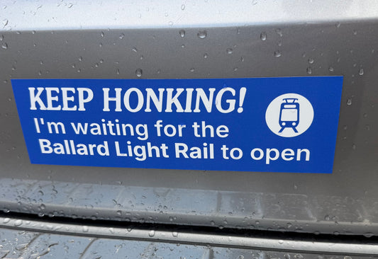 Keep honking! I'm waiting for the Ballard Light Rail to open blue car magnet